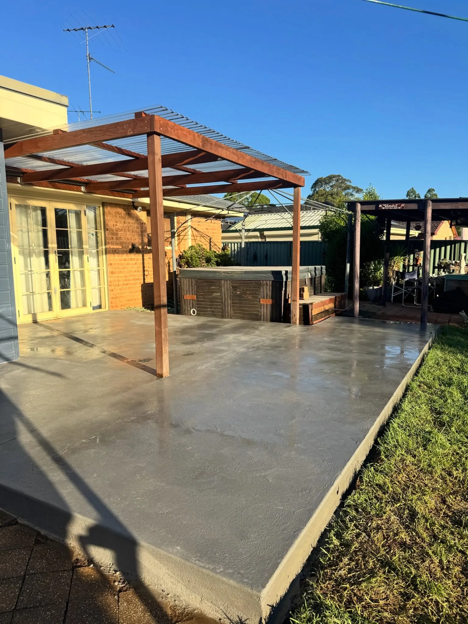 Patio slab under a timber pergola