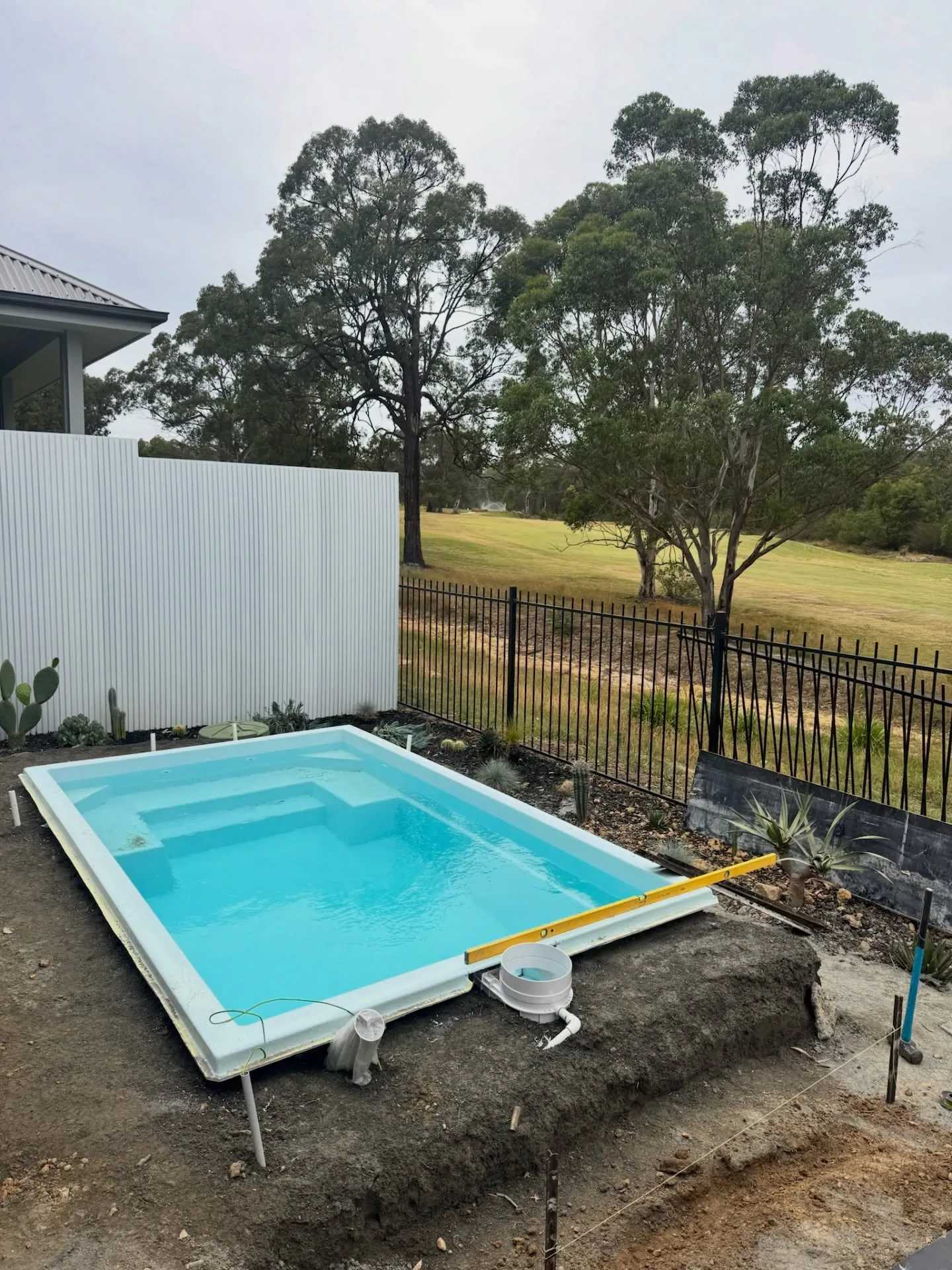 Fibreglass pool set in a new concrete surround